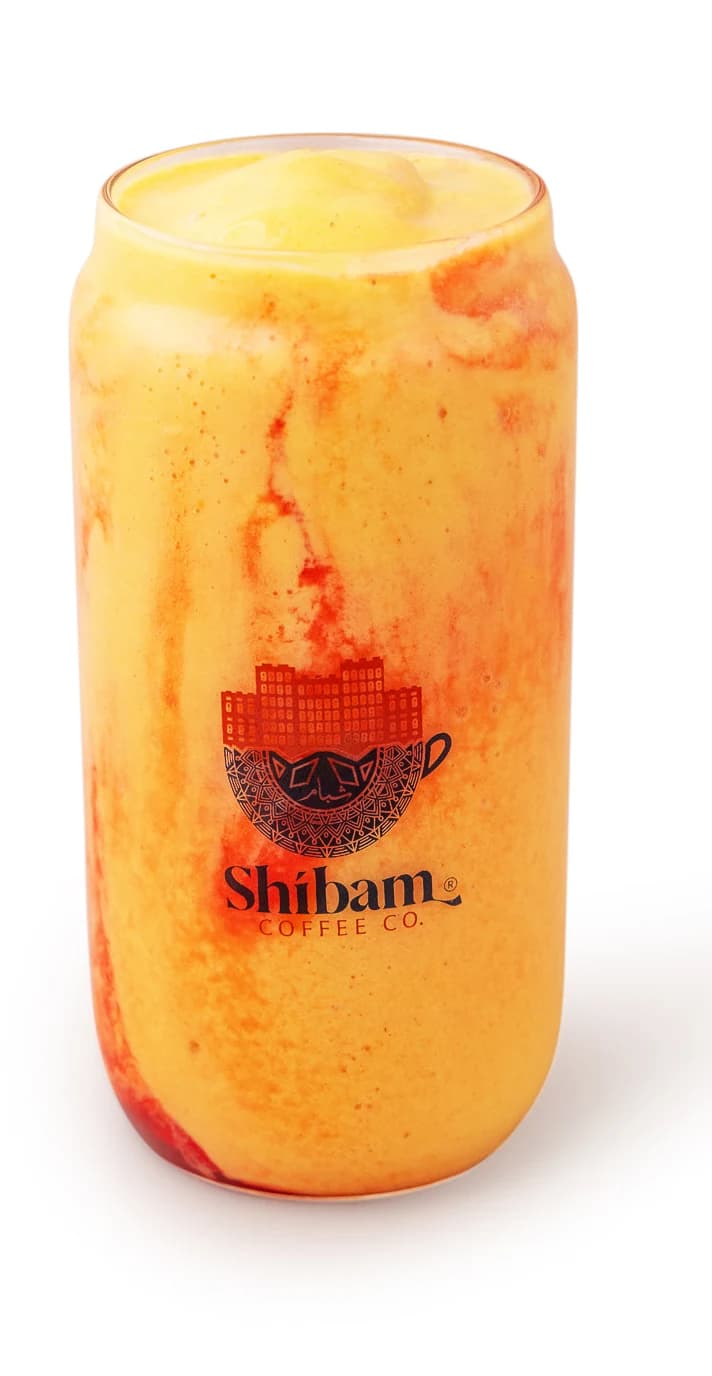 Shibam Royal mango drink in a Shibam Coffee glass