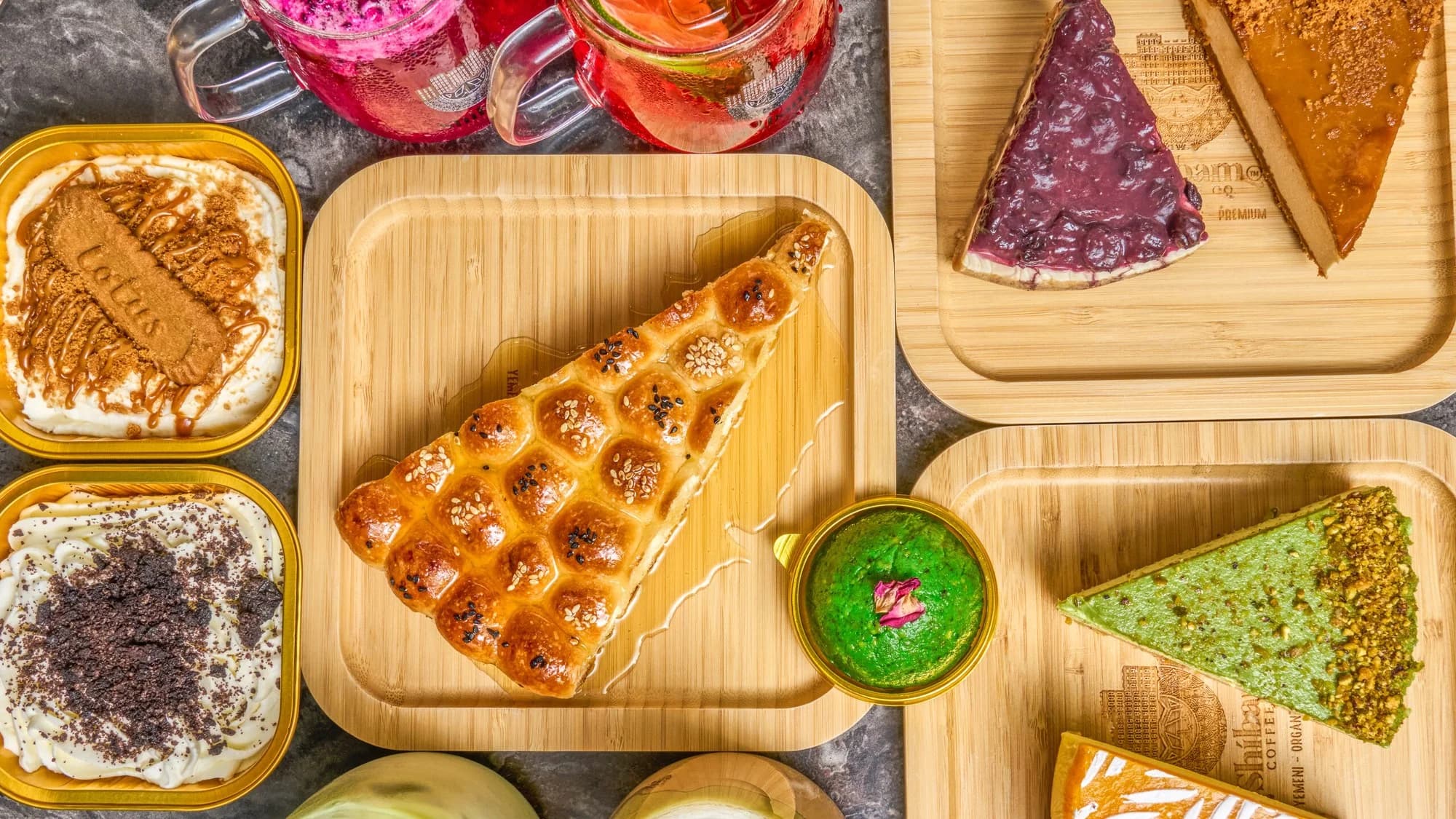 A shared table of Shibam drinks and pastries